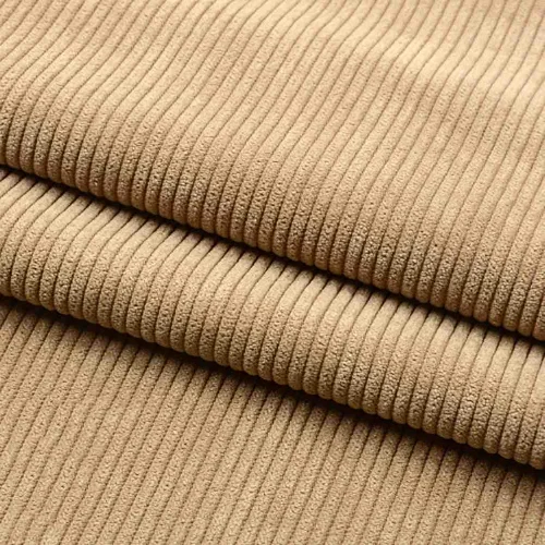A close up of a beige corduroy fabric perfect for skirts