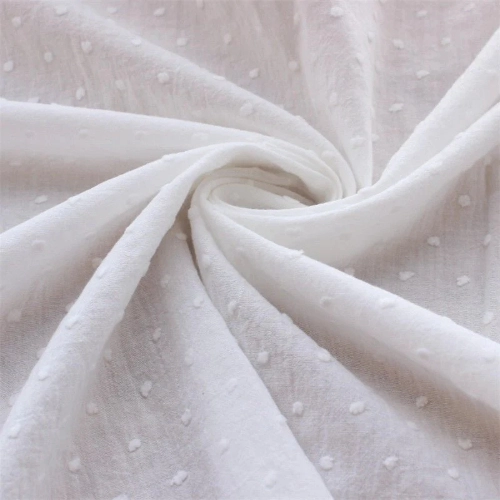 A close up of white cotton fabric suitable for pants