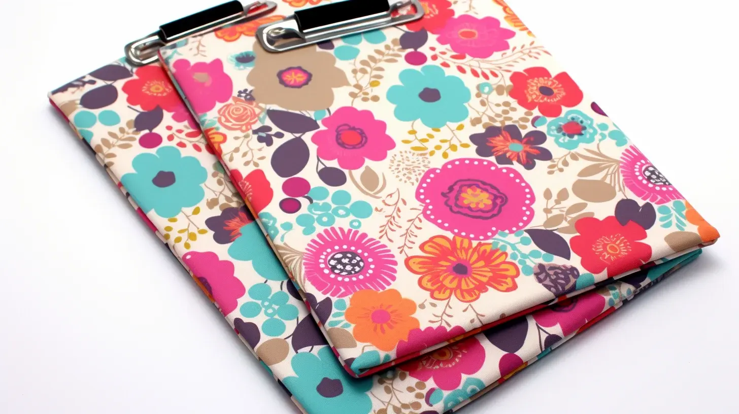 Two clipboards adorned with colorful flowers; a perfect addition to your Easy DIY Fabric Scrap Projects.