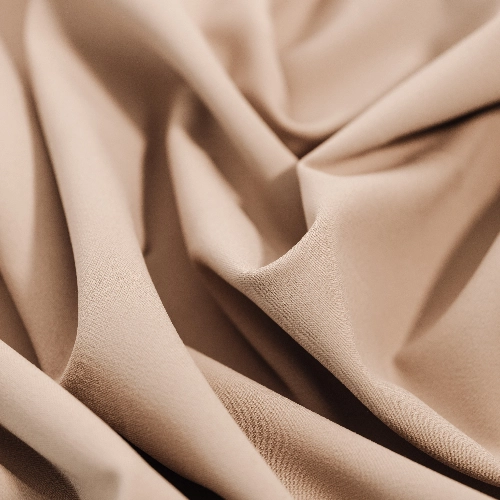 A close up of beige Gabardine fabric suitable for pants