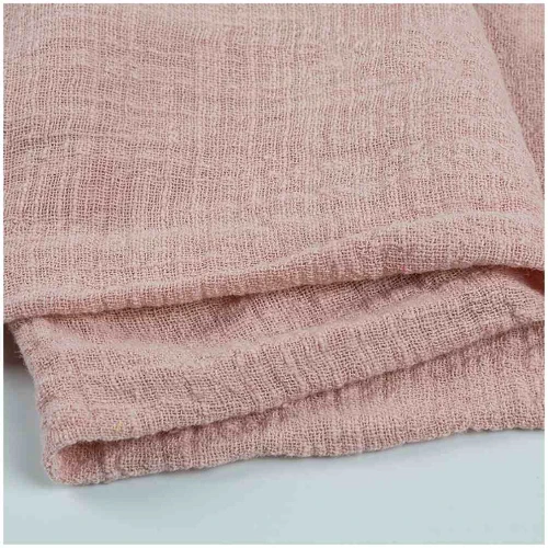A close up of pink linen fabric suitable for pants