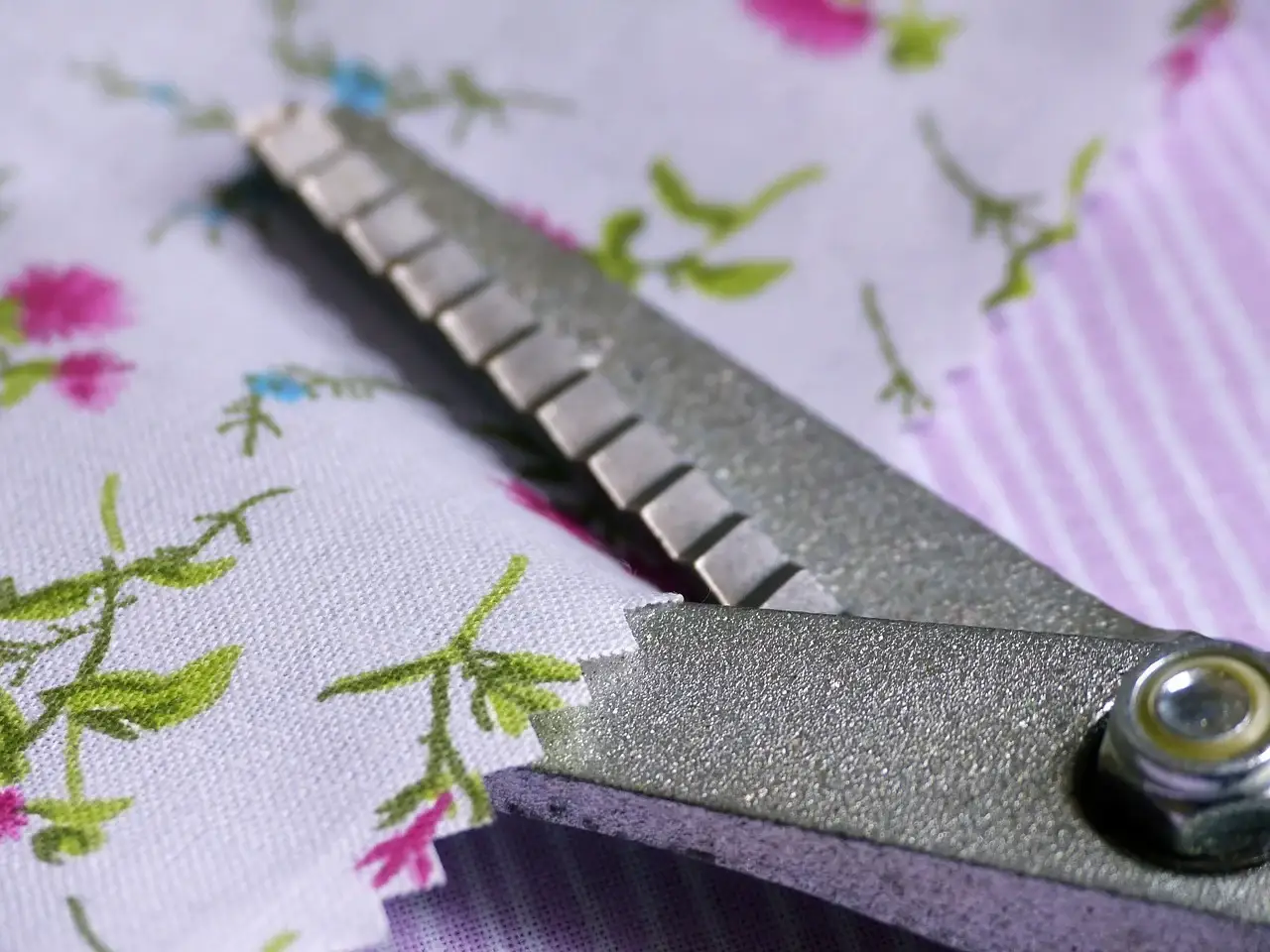 A pair of Pinking Shears on a piece of fabric.