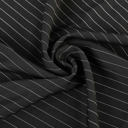 A close up of dark polyester fabric suitable for pants