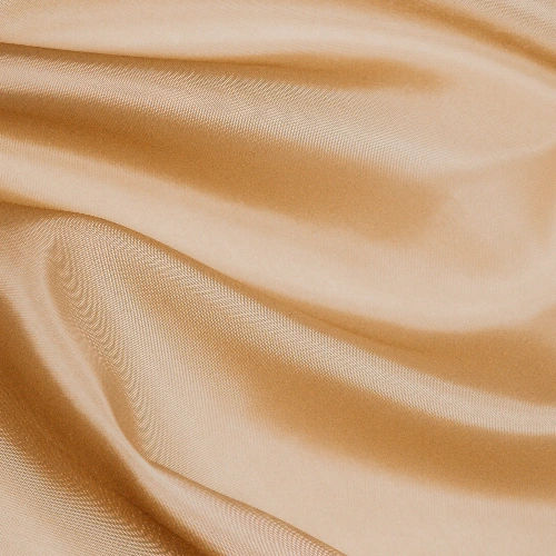 A close up image of a beige rayon fabric perfect for skirt fabrics