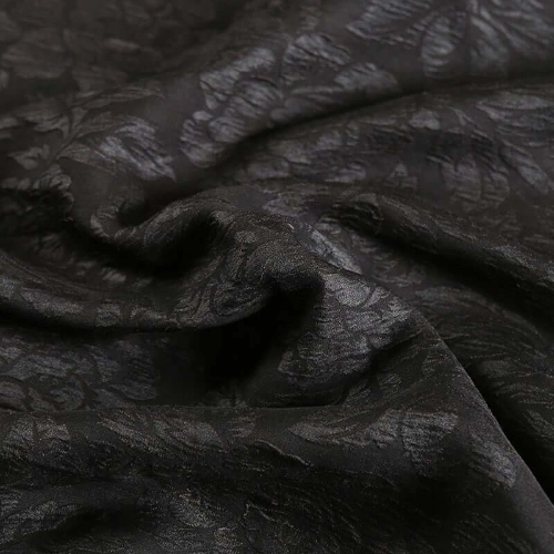 A close up of a black silk.