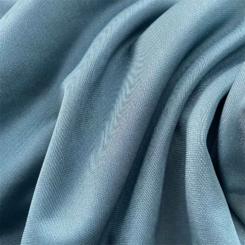 A close up of blue stretch fabric suitable for pants