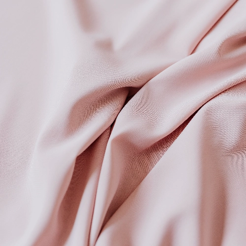 A close up image of a pink taffeta fabric suitable for a skirt