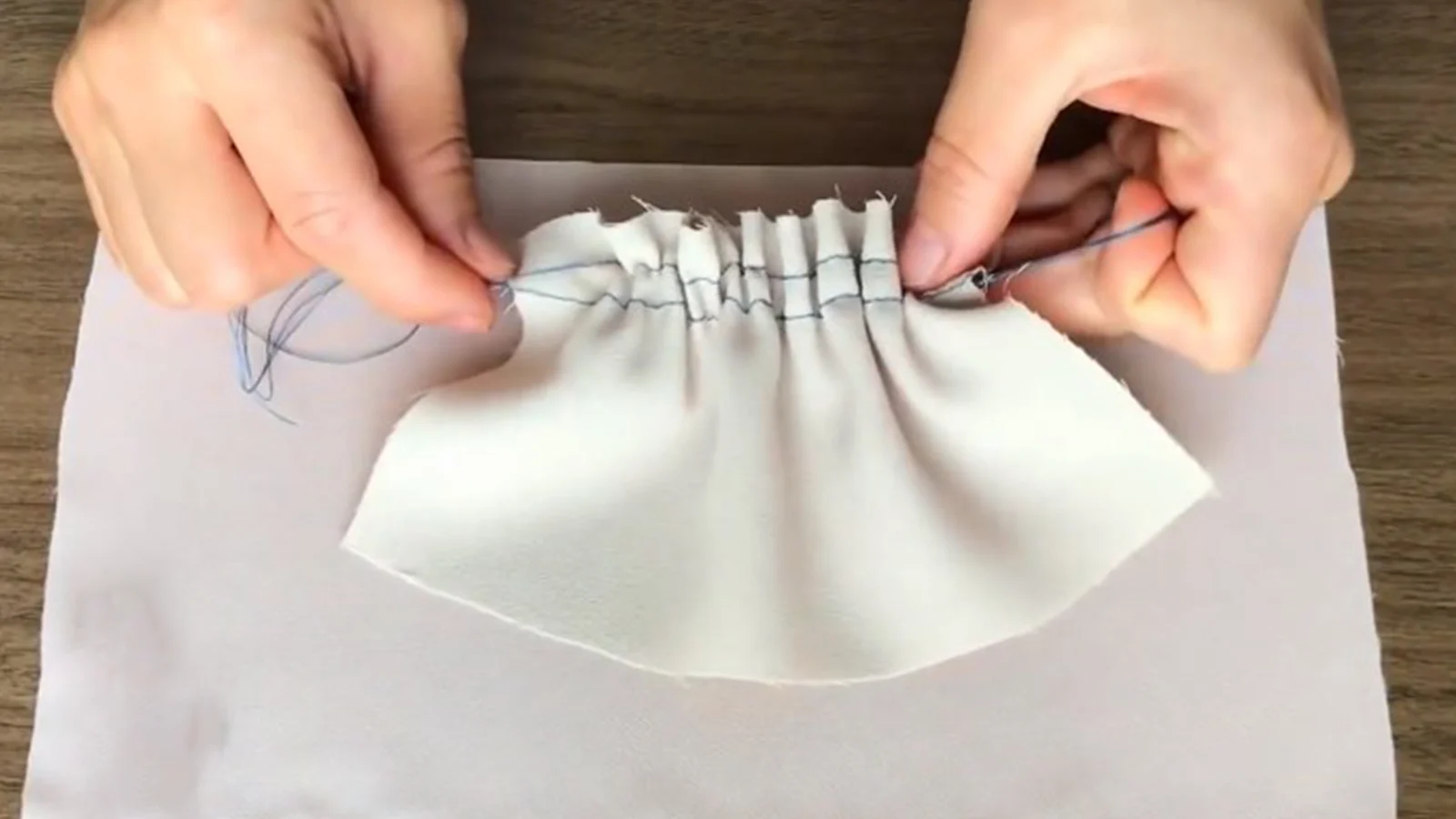 How to sew a pleat on a piece of paper.