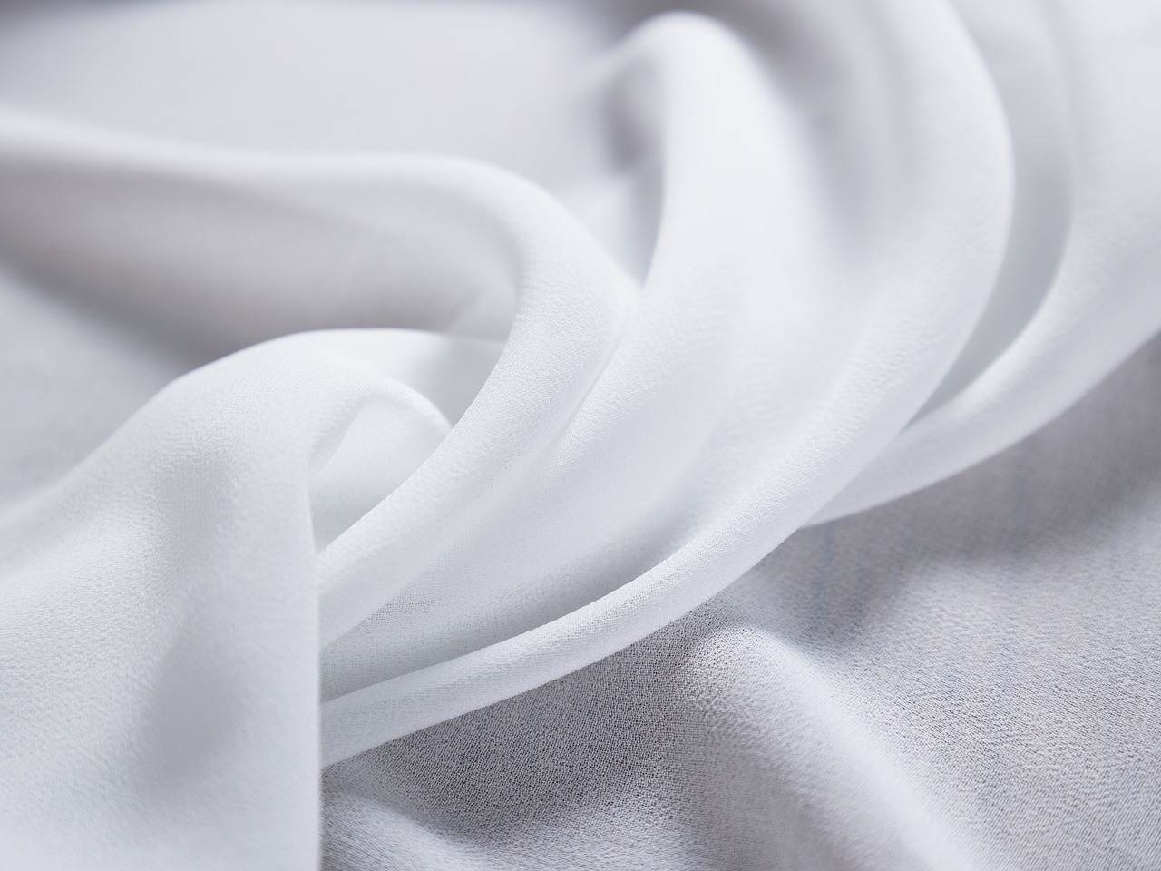 A close up image of a white fabric.