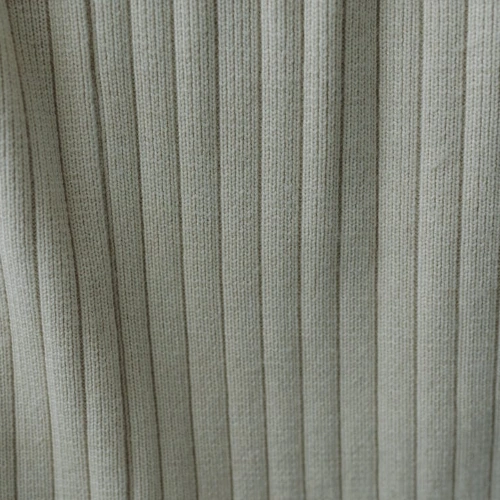 A close up of white wool fabric suitable for pants