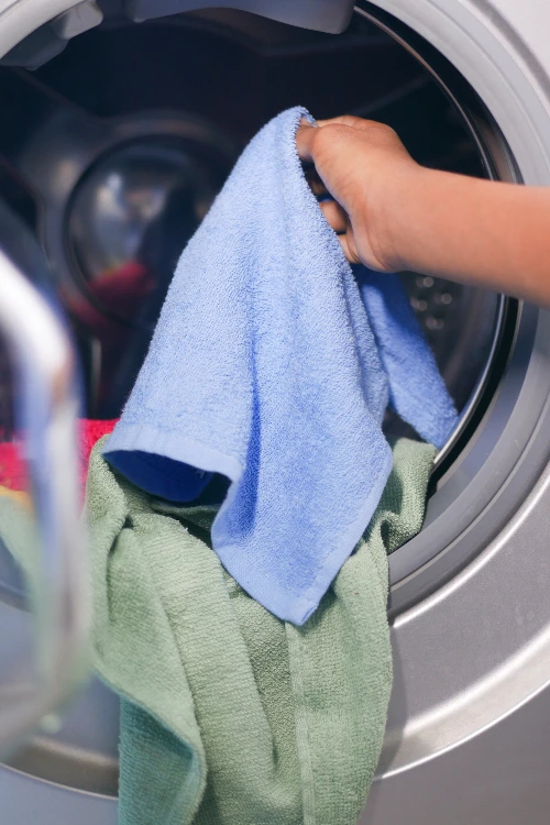 Put some cotton towels into the dryer, leading to shrinkage.