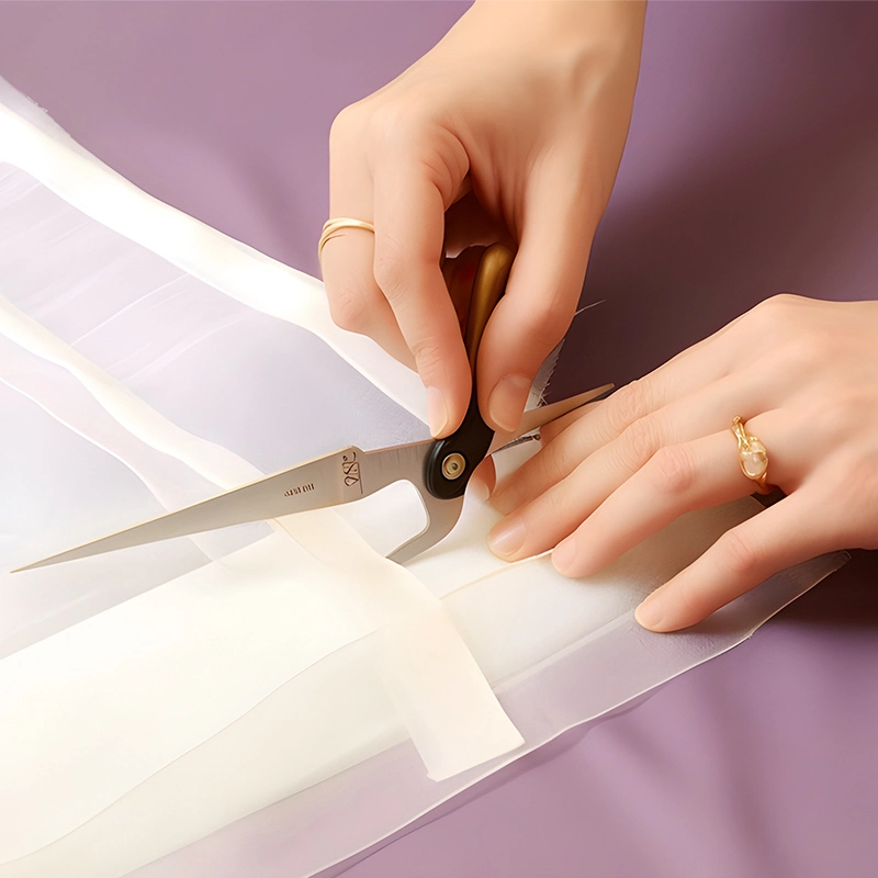 Step 2 to hem curtains without sewing: cut the excess curtains.