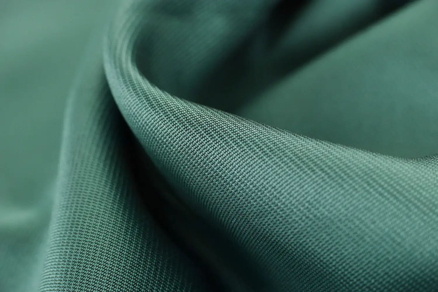 A close up of a green olefin fabric