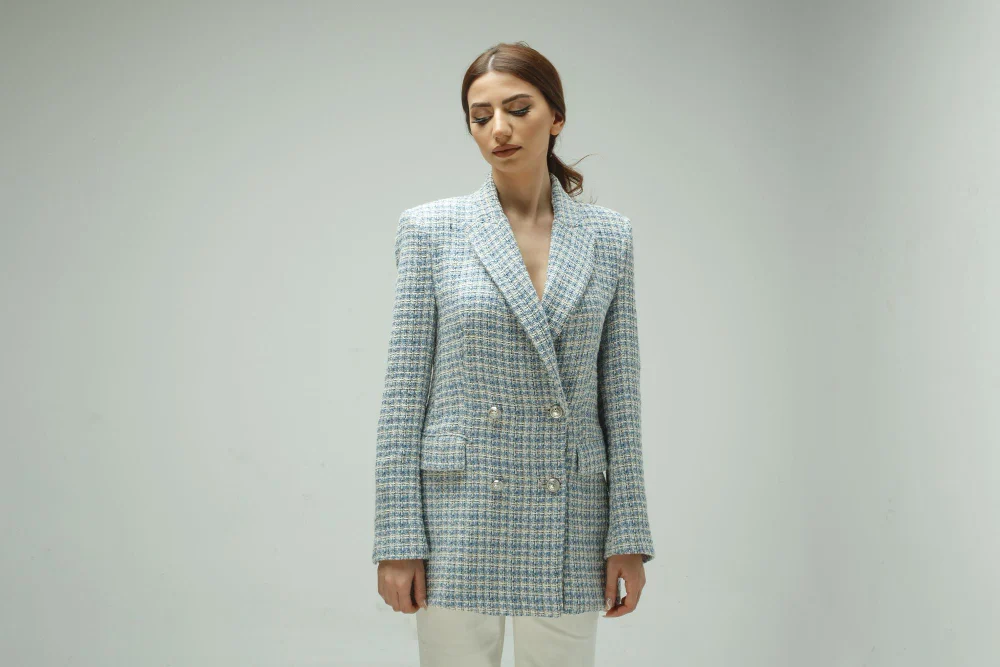 A woman wearing a tweed suit